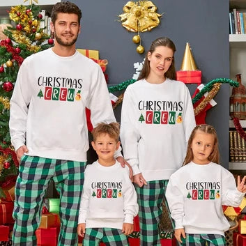 A family wearing christmas pajamas