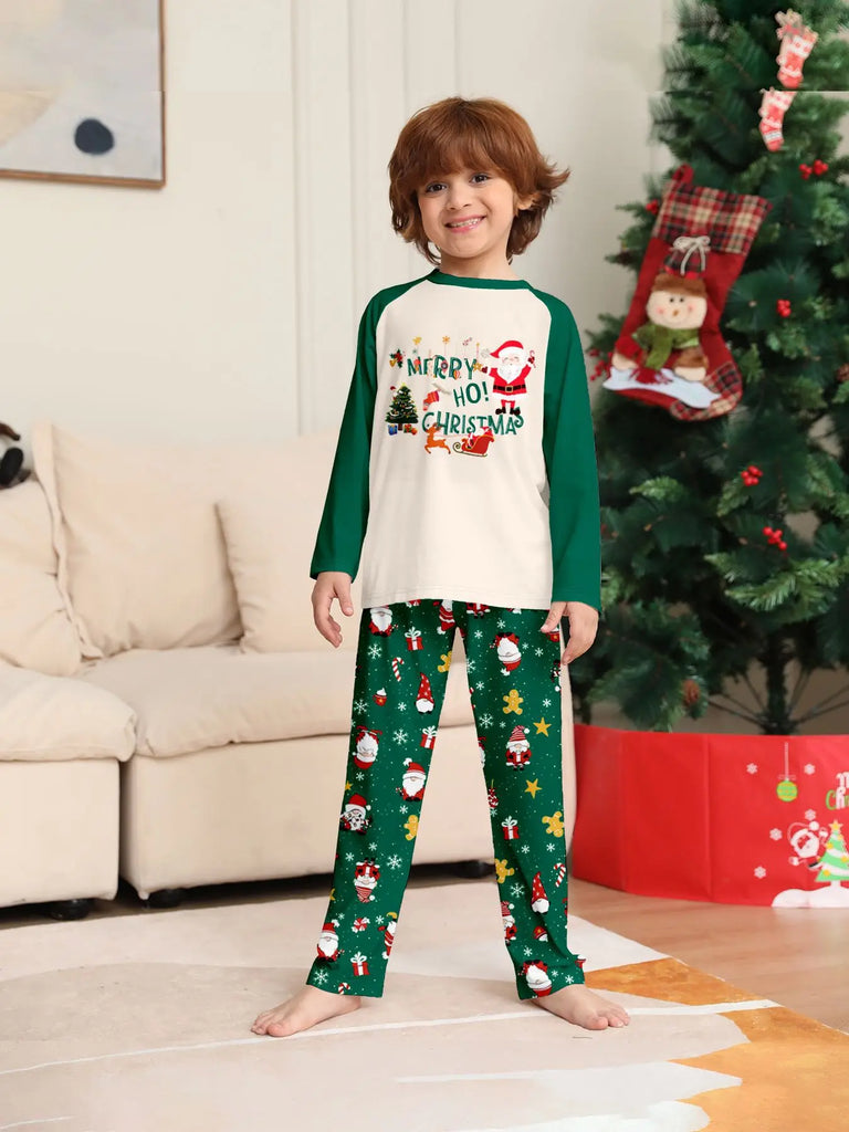 Fun matching family pyjama set with green Santa print