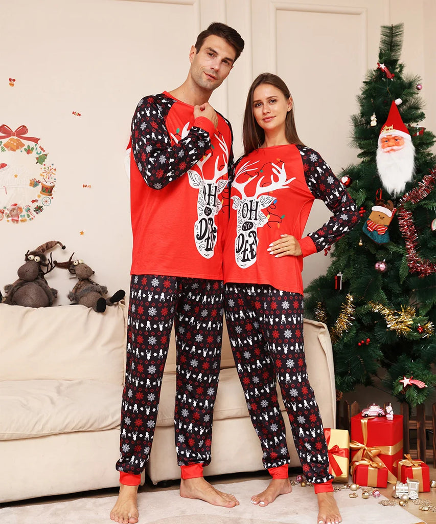 A couple wearing Oh Deer matching pyjamas