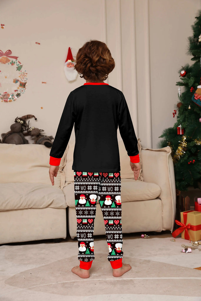 Family matching pyjamas with festive Santa hats