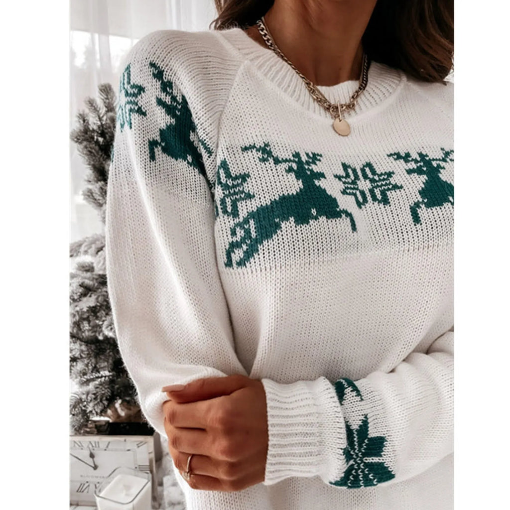 Women’s green Christmas jumper with white snowflakes and reindeer